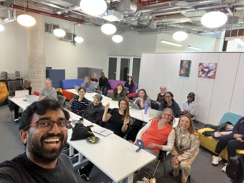 Mahdi with attendees at a Better Space Women's Intro to AI session