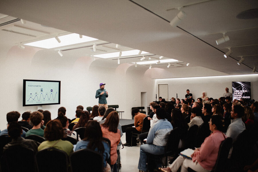 Wide view of the audience and slides during Mahdi's talk at OffScript Vision Festival 2026